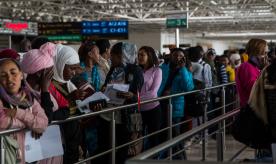 Ethiopian migrant workers in line at Bole International Airport