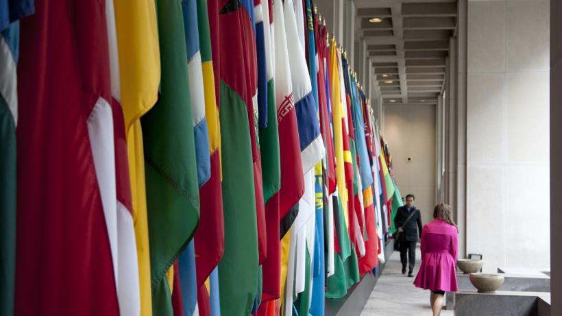 A series of flags from different nations hanging in a corridor, from the 2013 World Bank/IMF Annual Meetings. Photo: Simone D. McCourtie / World Bank. CC BY-NC-ND 2.0 DEED.