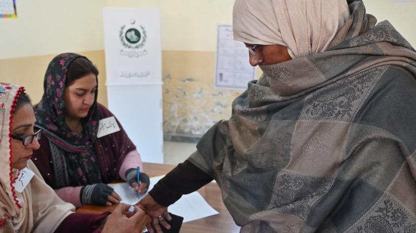 Woman voting at a polling station during Pakistan's national elections