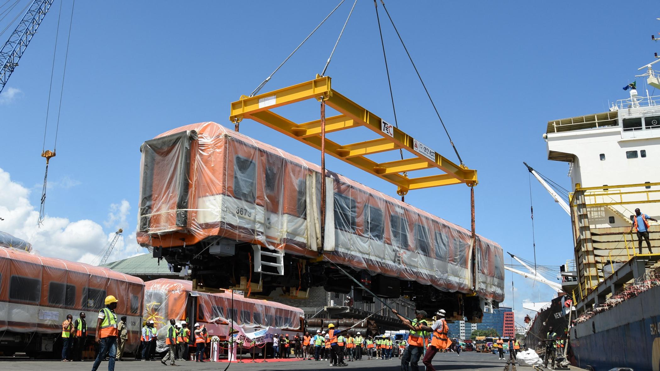 A carriage for the Tanzania's Standard Gauge Railway is unloaded