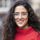 An image of Veronica Salazar Restrepo wearing glasses with long, dark curly hair.