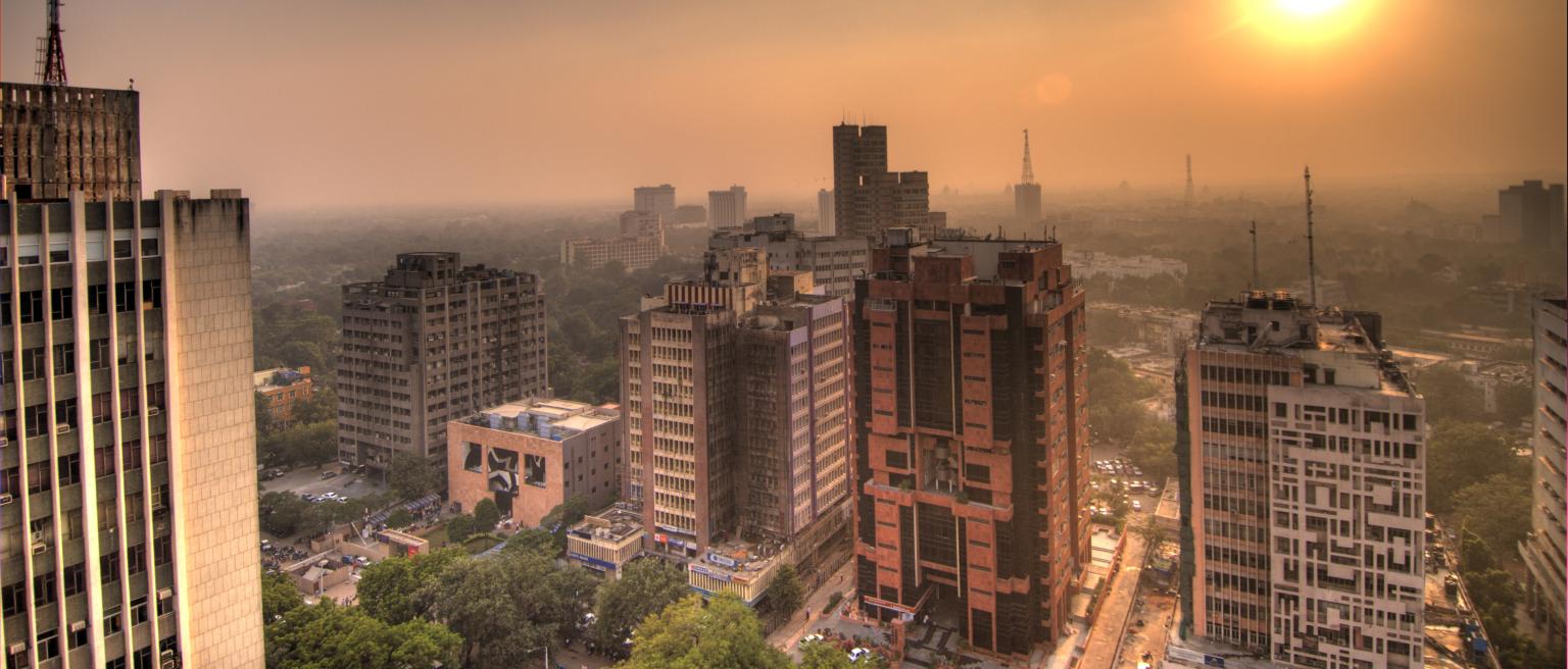Delhi skyline with green cover in background. 