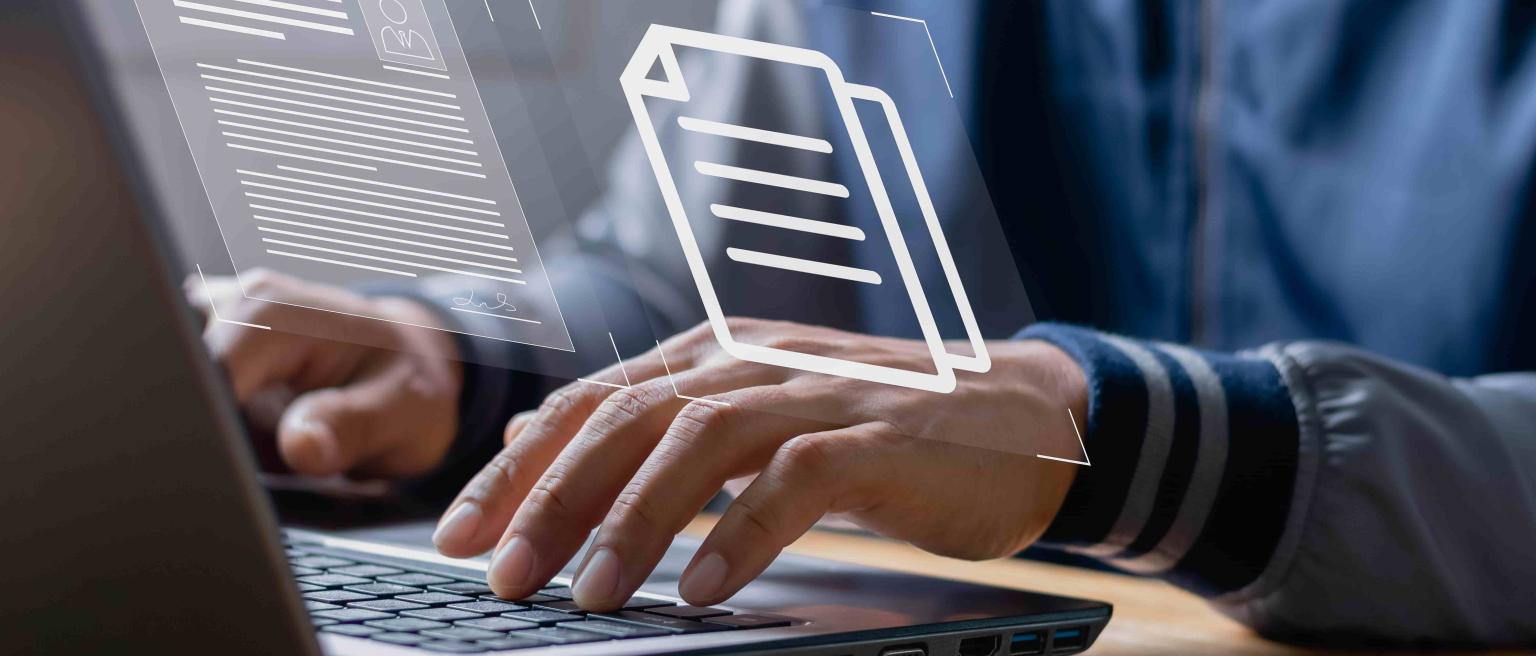 An image of a person working on a laptop with data graphics superimposed to demonstrate how AI is changing the way labour force surveys are analysed in Zambia.