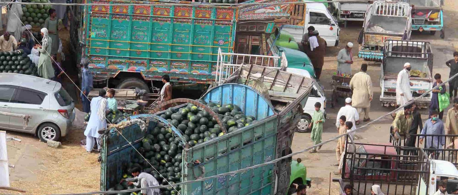 A photo of a busy trading port in Pakistan carrying food and other goods. 