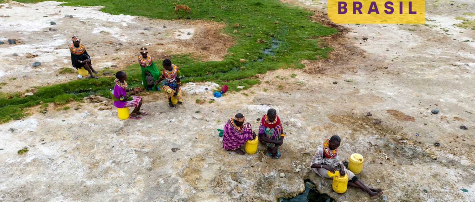 Women collecting water in plastic containers from a volcanic spring, Turkana region, Kenya (Credit: Martin Harvey via GettyImages)
