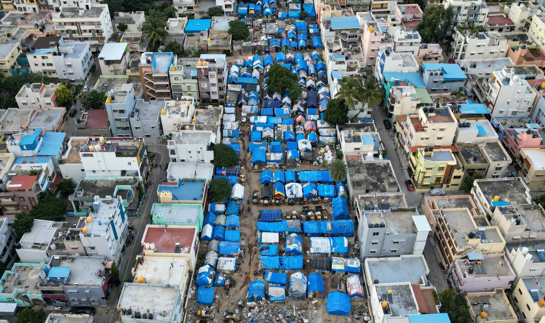 An aerial view of an informal settlement amidst an urban residential area in Bengaluru, India