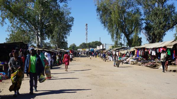 People walking on a road in Makkala nguzu Market, Choma, Zambia