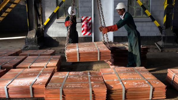 Copper is a critical mineral for clean energy. Workers in Zambia moving copper at a warehouse in Zambia to be transported to ports such as Dar es Salaam, Tanzania, and Durban in South Africa.