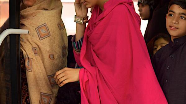 Women travelling on a bus in Pakistan illustrating the challenges of safe transportation.