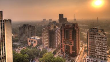 Delhi skyline with green cover in background. 