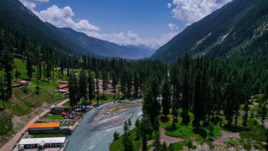 The picturesque landscape of Khyber Pahtunkhwa in Pakistan with mountains, streams and trees to explore tree cover as part of the Billion Tree Tsunami Afforestation Programme.
