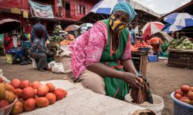 Woman sells tomatoes