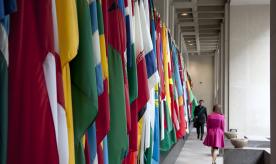 A series of flags from different nations hanging in a corridor, from the 2013 World Bank/IMF Annual Meetings. Photo: Simone D. McCourtie / World Bank. CC BY-NC-ND 2.0 DEED.