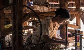 A woman weaving cotton in Inle Lake, Myanmar. Photo by Stefano Ravalli/ Creative commons via Flikr
