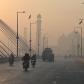 Commuters during heavy smog in Lahore