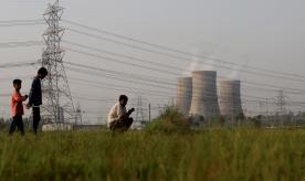 People are seen near the National Thermal Power Corporation (NTPC) Ltf. plant in Gautam Budh Nagar district of Ghaziabad, India on May 05, 2022.