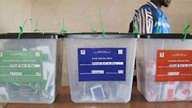 Ballot boxes and ballots for Presidential, Senatorial and House of Representatives Elections, Fawe Elementary School Voting Precinct; Monrovia, Liberia; 11 October 2011. Photo credit: Xav C. Hagen via Wikimedia Commons, CC BY 2.0.