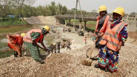 Women bricklayers repair bridge in Bangladesh