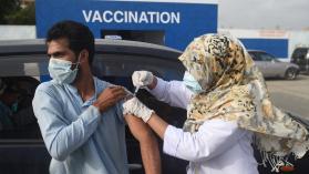 Man receives COVID-19 vaccine at drive through