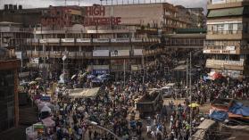 Relationship between population growth illustrated by a busy traffic intersection in Kampala, Uganda.