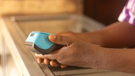 Man hands holding pos machine.jpg