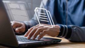An image of a person working on a laptop with data graphics superimposed to demonstrate how AI is changing the way labour force surveys are analysed in Zambia.