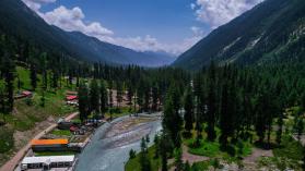 The picturesque landscape of Khyber Pahtunkhwa in Pakistan with mountains, streams and trees to explore tree cover as part of the Billion Tree Tsunami Afforestation Programme.