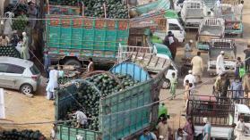 A photo of a busy trading port in Pakistan carrying food and other goods. 