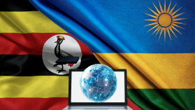 An image of the flags of Rwanda and Uganda laid against each other with a laptop and a globe in the middle to illustrate digital trade.