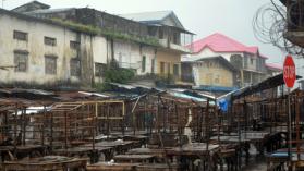 A street market remains empty in Monrovia's West Point slum as part of quarantine measures to contain the spread of Ebola in Liberia on August 20, 2014. Photo credit: ZOOM Dosso / AFP via Getty Images.