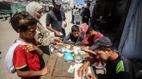 Palestinians rehabilitate and restore damaged and worn-out banknotes due to the halt in currency transfers from Israeli banks to Palestinian bank.