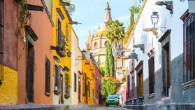 Narrow street in the old town of San Miguel de Allenge, Mexico. Photo credit: Marco Bottigelli / Moment via Getty Images.