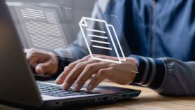 Businessman working on laptop with icons on virtual screen, Online documentation database and document management system concept.