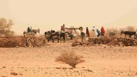 Sudanese men and women fetching water from a deep well in front of the abandoned archeological site of Naqa, in northern Sudan. The site has one temple devoted to Amun, another to Apedemak and a Roman structure. by JordiStock / iStock Editorial / Getty Images