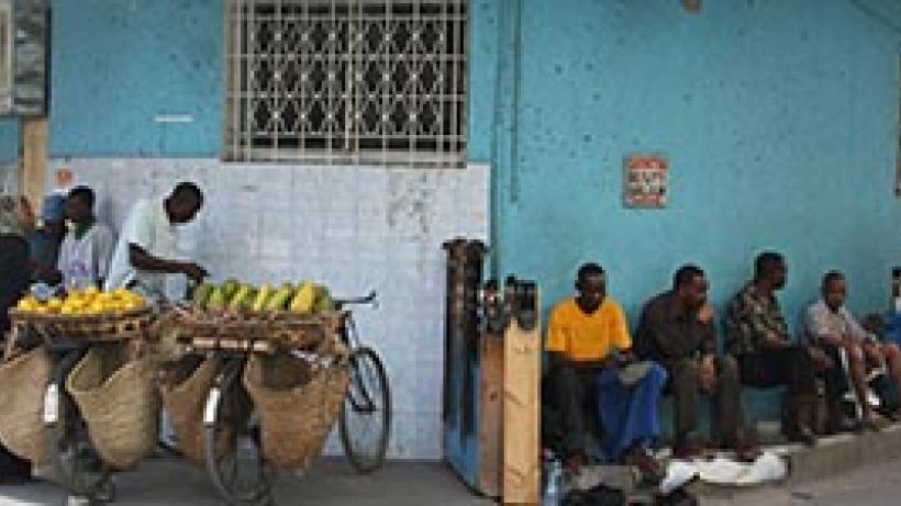 Men sitting in Dar es Salaam, Tanzania. Photo credit: Imke.sta via Flickr, CC BY-SA 2.0.