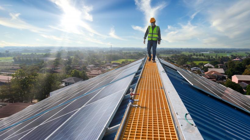 Technician checks the maintenance of the solar panels, engineering team working on checking and maintenance in solar power plant. Getty Images