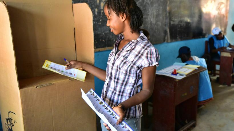 Woman casting her ballot