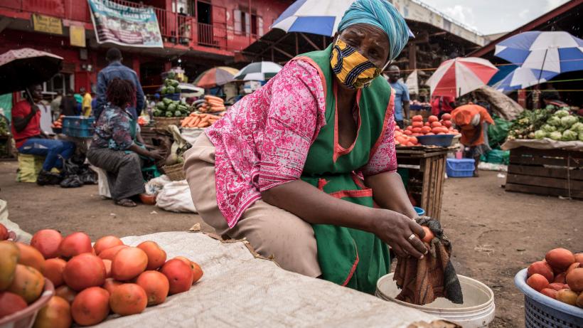 Woman sells tomatoes