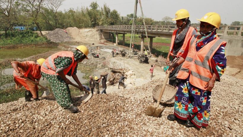 Women bricklayers repair bridge in Bangladesh