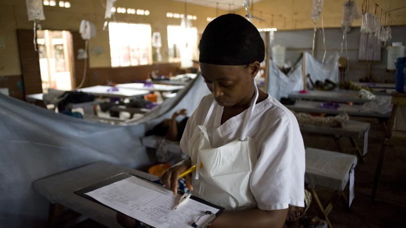 A nurse checks medical documents at the Wellington Cholera Treatment Unit (CTU), in Freetown on August 29, 2012