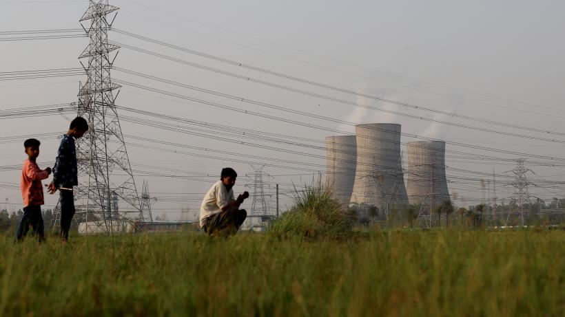 People are seen near the National Thermal Power Corporation (NTPC) Ltf. plant in Gautam Budh Nagar district of Ghaziabad, India on May 05, 2022.