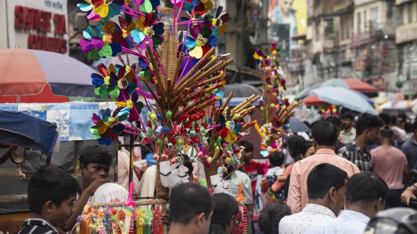 A vendor sells toys and other children's items at a street market ahead of the Durga Puja festival in Guwahati, India