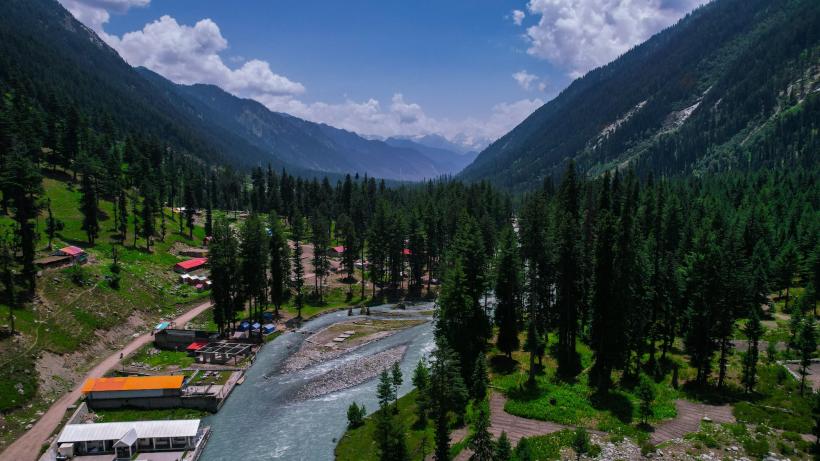 The picturesque landscape of Khyber Pahtunkhwa in Pakistan with mountains, streams and trees to explore tree cover as part of the Billion Tree Tsunami Afforestation Programme.