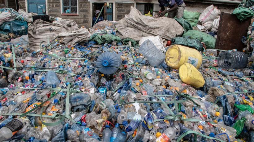 NIGERIA-ENVIRONMENT-POLLUTION Workers load plastic waste in to bags at Kara, Ibafo, Ogun State in southwest Nigeria, on April 1, 2021. - The sprawling neighbouring Lagos megacity of 20 million people produces between 13,000 and 15,000 tons of waste per day, including 2,250 0f plastics,according to the Lagos-based recycling sart-up Wecyclers. (Photo by PIUS UTOMI EKPEI / AFP) (Photo by PIUS UTOMI EKPEI/AFP via Getty Images)
