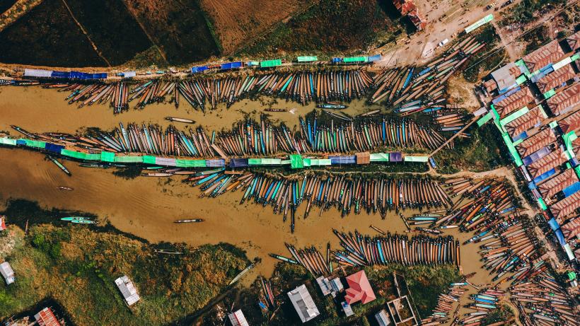 Scenic aerial view of a lot of boats near the market on Inle Lake, Myanmar. Photo credits: Oleh Slobodeniuk / E+ via Getty Images.