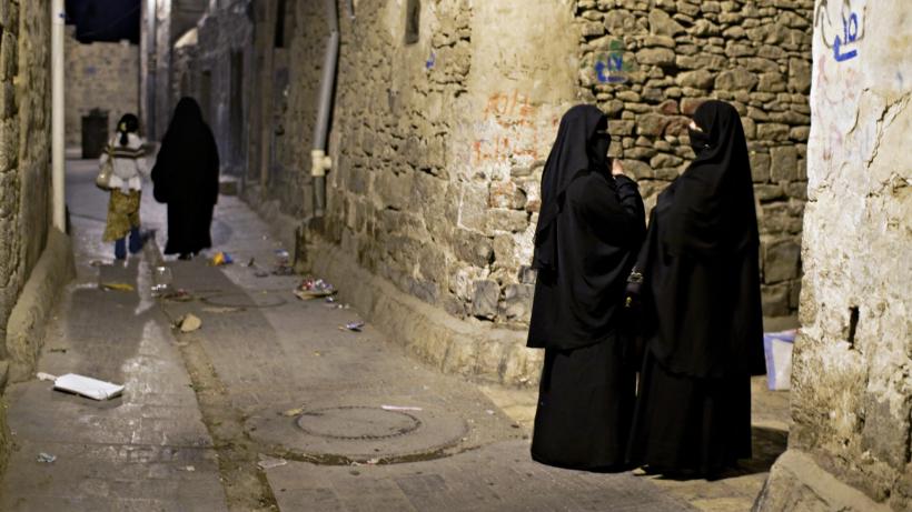 Two women in traditional clothing in the old town of Sana'a.Yemen, December 2007 Credit: Macie J. Stangreciak / Moment Open via Getty Images.