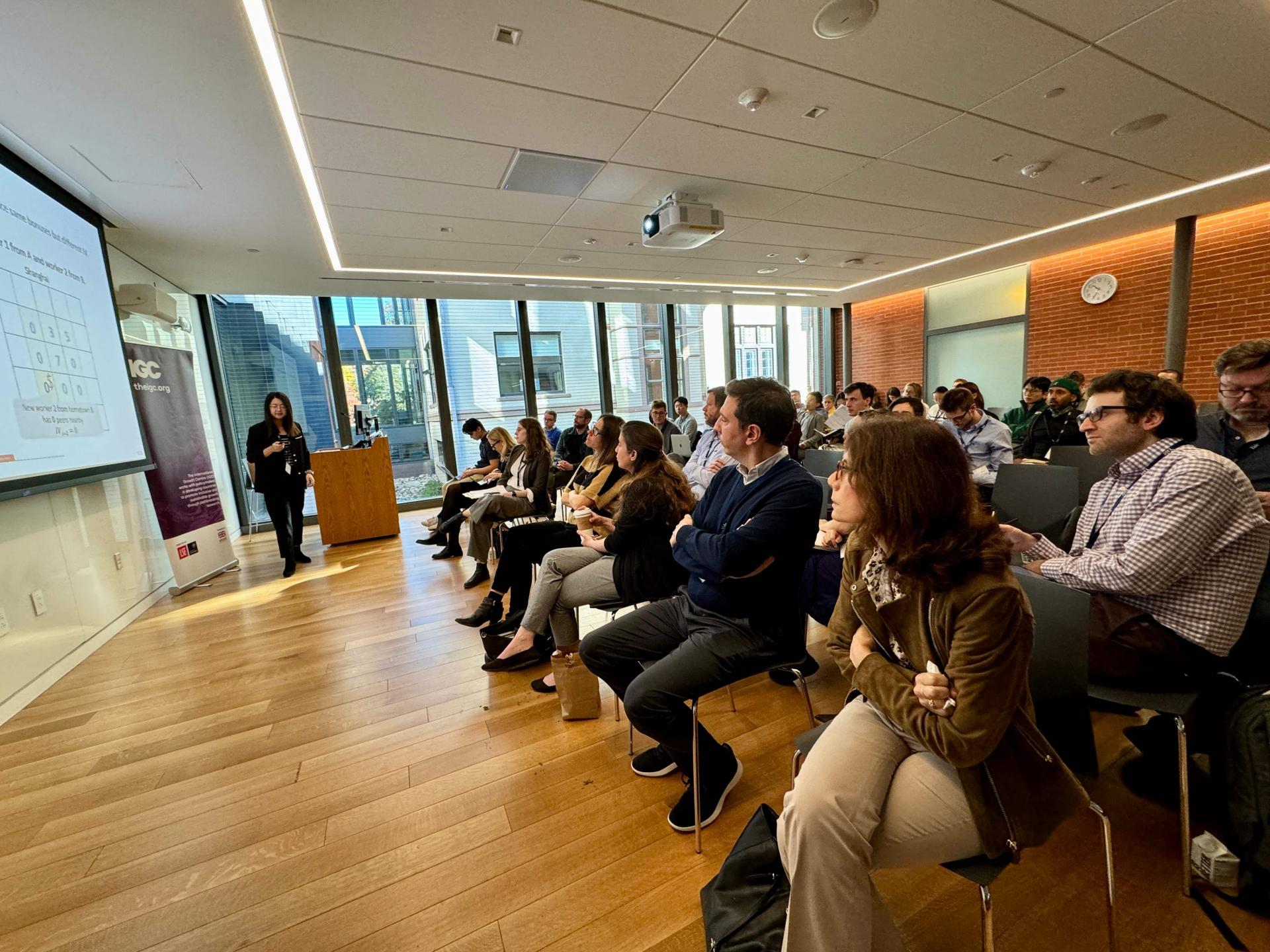 A photo of young attendees at the Firms Trade and Development Conference listening to a lecture 