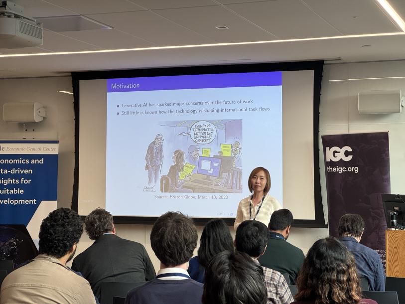 Maggie Chen presenting at the Firms, Trade and Development Conference