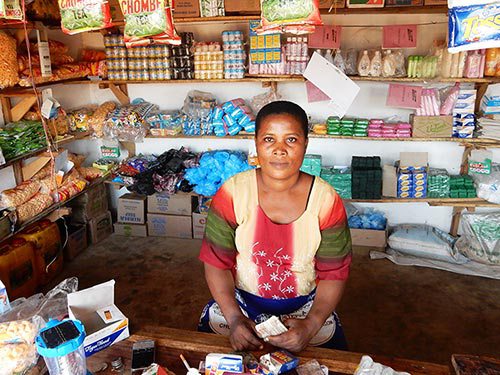 Christina Charles sits in her grocery store in Ndirande