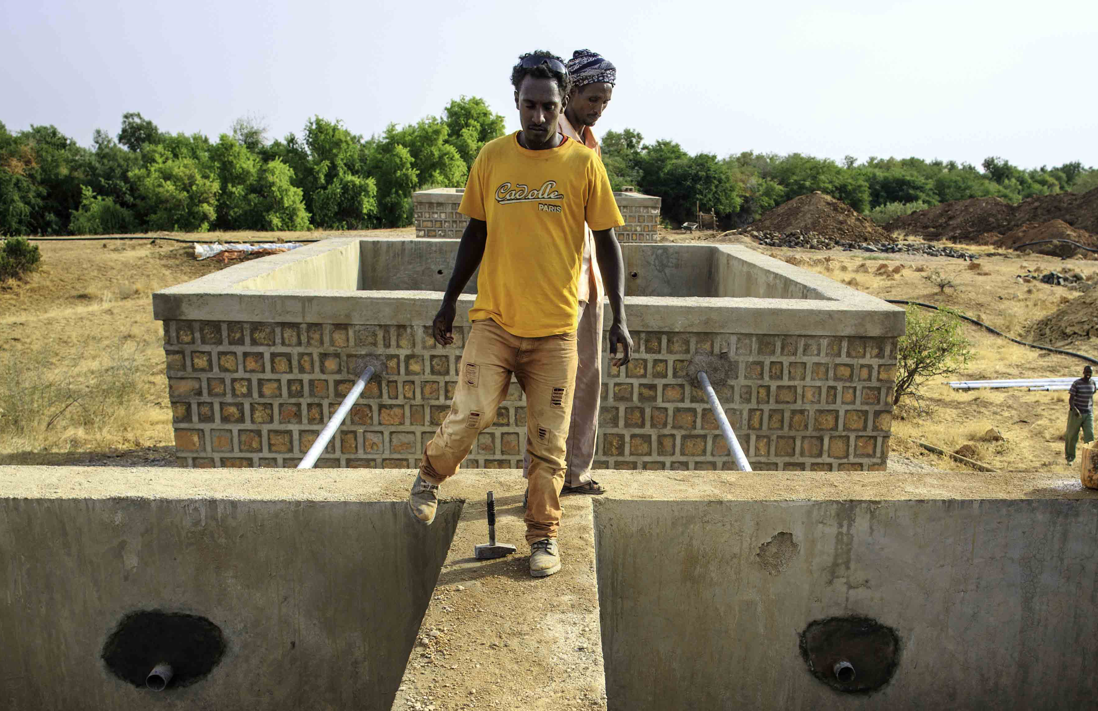 Filtering tanks are filled with gravels inside one of 3 filtering tanks of a river intake construction by Shebele River in Yahas-Jamal Kebele in Somali region of Ethiopia 11 February 2014. In Somali Region water supply coverage is estimated at 59.7%, lower than the national average of 68.5%. The need for water supply normally increases in the dry season, especially at the time of drought such as in recent years. However, the technical and organizational capacity of the Somali Regional State Water Resources Development Bureau (SRWDB) the government agency responsible for water supply and facilities management in the region to satisfy the water supply need is not adequate to cope with the situation. Donor agencies and NGOs are making efforts to ameliorate the situation by constructing and repairing water supply facilities across the region, supplying water by water trucks during chronic shortages, but the supply is still significantly below the demand.